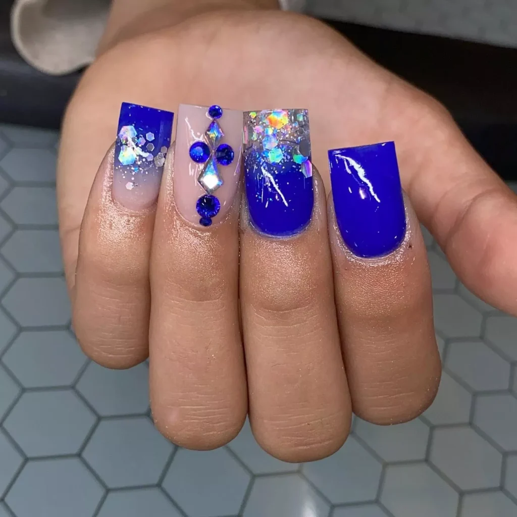 blue and silver sparkly nail design