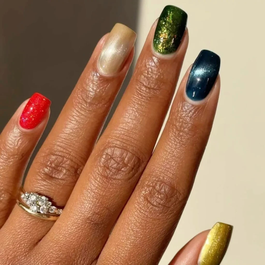 red and gold nails with glossy nail art style